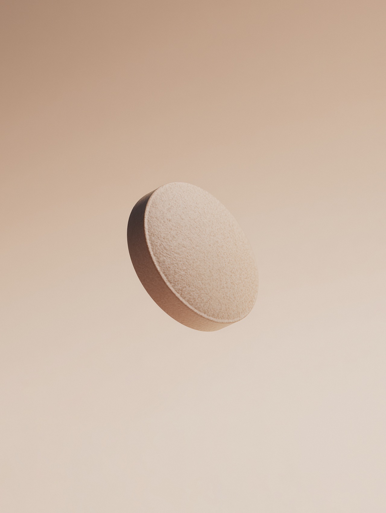 A pale capsule floating against a soft warm cream backdrop — a daily dose, suspended.